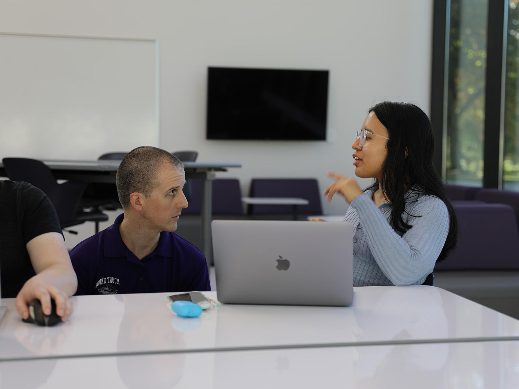 A student and professor in a data science class